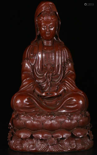 A LACQUER WOOD GUANYIN SITTING FIGURE WITH QIANLONG MARK