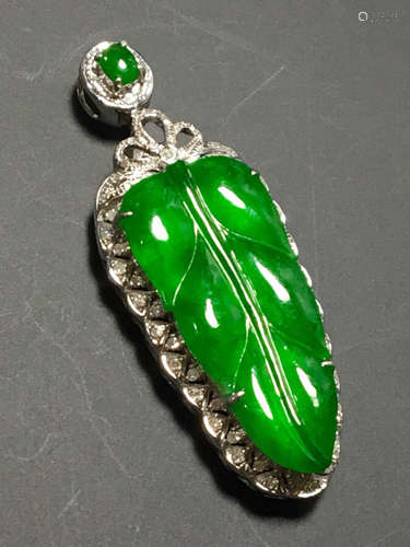 A GREEN JADEITE PENDANT OF TREE LEAF