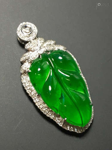 A GREEN JADEITE PENDANT OF TREE LEAF