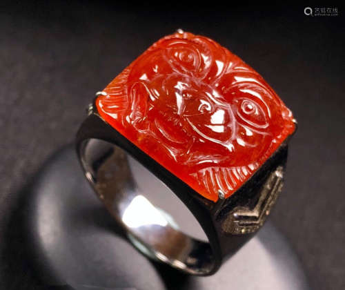 A RED JADEITE RING OF BEAST