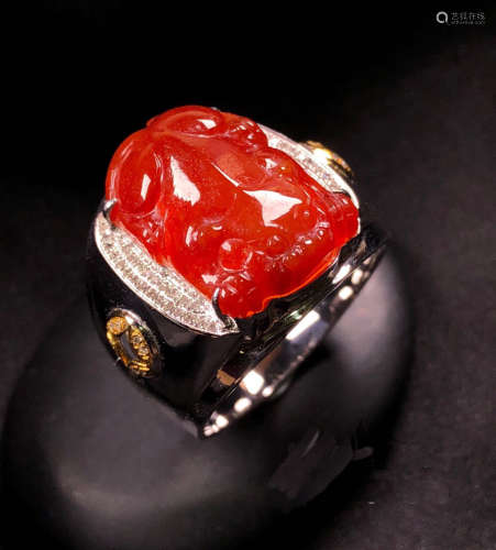 A RED JADEITE RING OF PIXIU