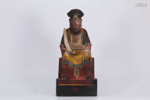 A COLORED WOOD SCULPTURED FIGURE