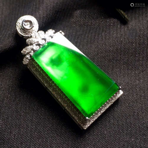 A GREEN PENDANT OF PEACEFUL TABLET