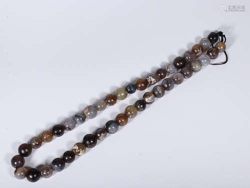 A STRING OF OLD AGATE BEADS