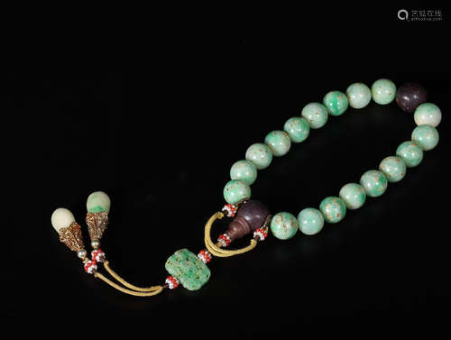 A STRING OF JADEITE BRACELET