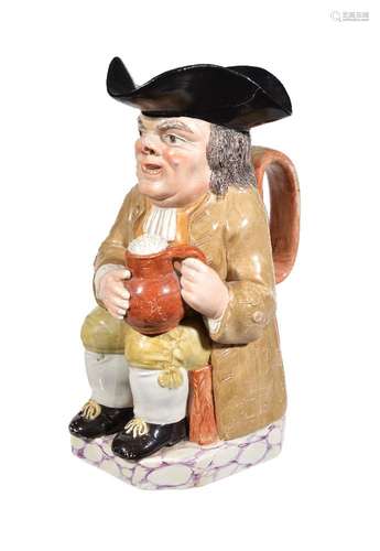 A Neale & Co. pearlware Toby jug, circa 1790, painted in shades of brown and ochre and on a