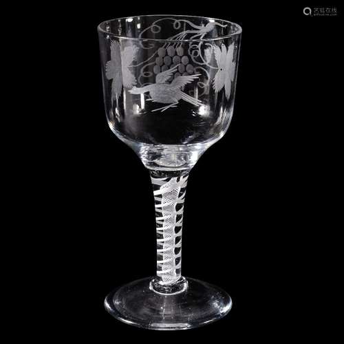 A large engraved opaque-twist wine glass, circa 1760, the generous ogee bowl decorated with a bird