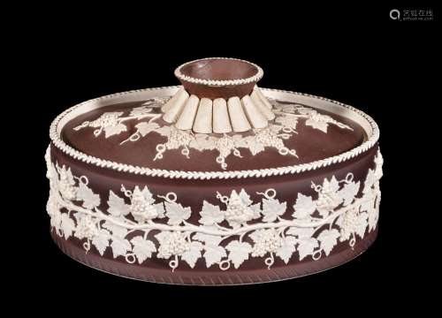 A Turner white stoneware and brown slip decorated pie dish and cover, circa 1800, sprigged in relief