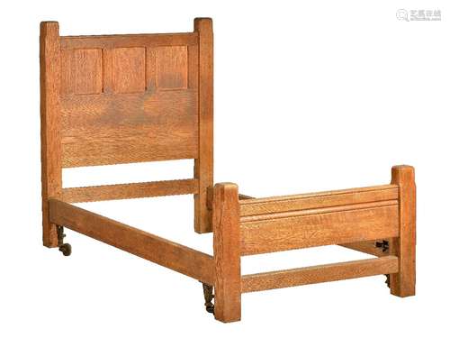 An Arts & Crafts oak Cotswold School single bed, circa 1910, probably by Heals or Liberty, the