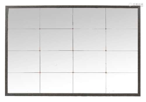 A wall mirror, of recent manufacture, the frame to simulate patinated metal surrounding sixteen