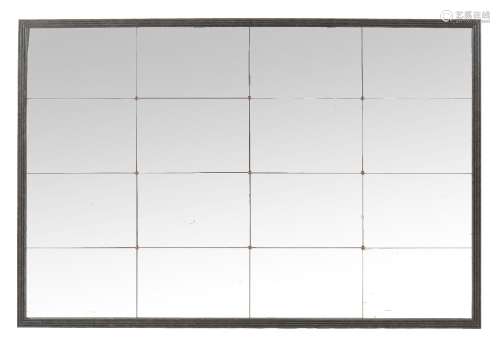 A wall mirror, of recent manufacture, the frame to simulate patinated metal surrounding sixteen