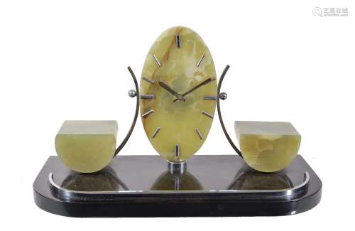 An Art Deco green and black onyx mantel clock, the eight day timepiece movement with six rubies,