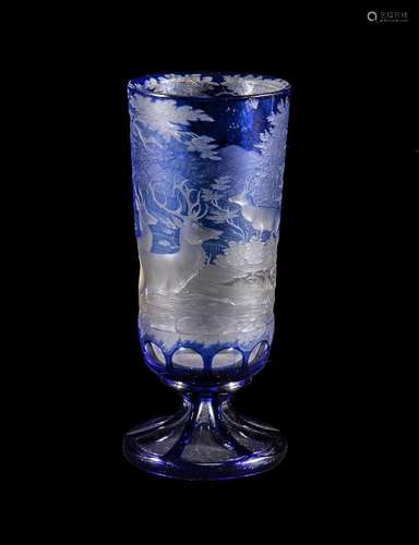 A Bohemian clear-glass and engraved blue-flashed tall slender goblet, third quarter 19th century,