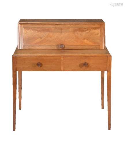 An English walnut desk, no maker's mark, CC41 mark, circa 1950, in the manner of Gordon Russell,