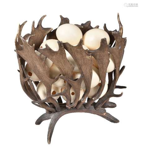 A fallow deer antler formed jardiniere stand, circa 1900, of openwork construction and oval section,