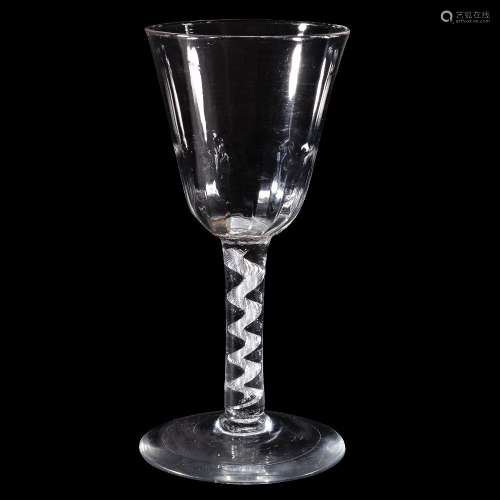 An airtwist wine glass, circa 1750, the round funnel bowl with hammered lower section, supported