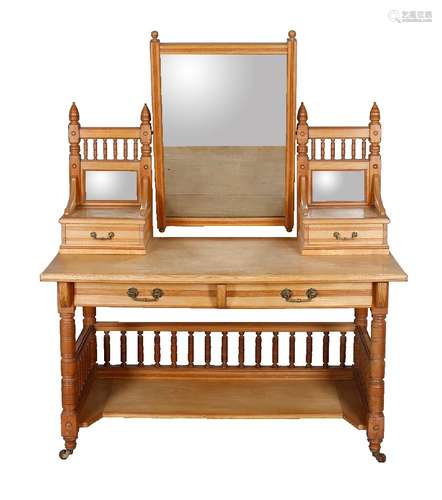 An Aesthetic Movement ash dressing table by Heal & Son, circa 1890, with galleried and mirror backed