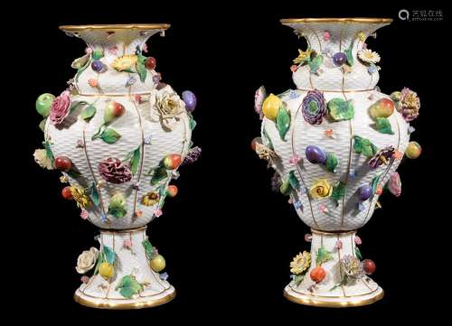 A pair of Meissen (outside decorated) flower and fruit encrusted ozier-moulded baluster vases,