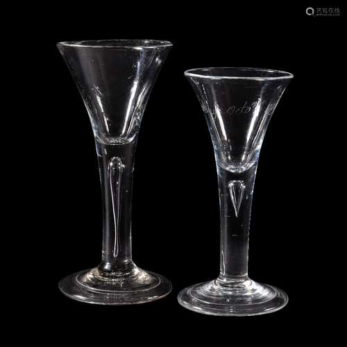 Two plain-stemmed wine glasses of drawn trumpet form, circa 1740, each with a tear inclusion and a