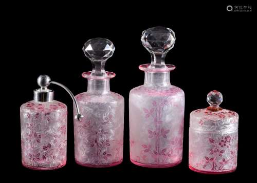 A French pale-pink overlay and clear glass part dressing table set, probably Baccarat, first quarter
