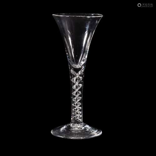 A mercury-twist wine glass, mid 18th century, of drawn trumpet form and supported on a stem with a