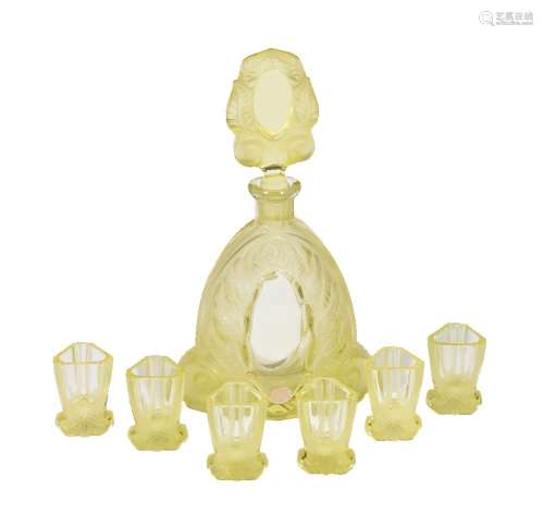 A Czechoslovakian yellow glass annagelb press-moulded and frosted glass spirit set, circa 1960,