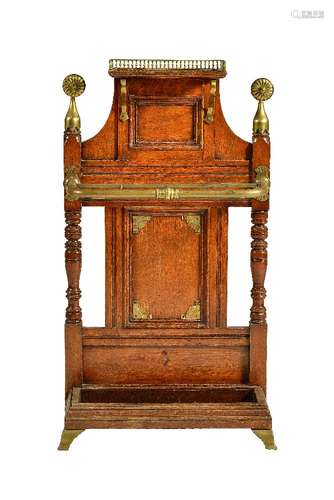 A Victorian oak and brass mounted hall stand, circa 1890, in Aesthetic taste, following a design