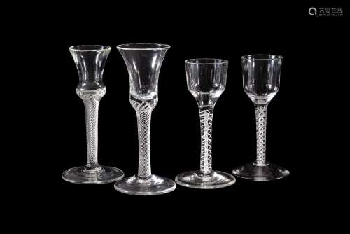 Three various eighteen century drinking glasses, comprising: two various opaque-twist wine