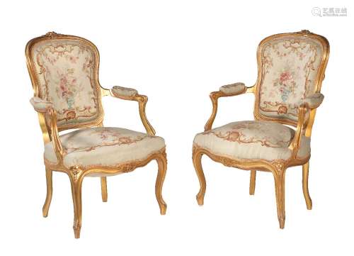 A pair of giltwood and petit point upholstered armchairs in Louis XVI style