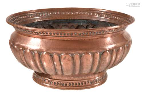 A Continental, probably Italian, repoussé copper wine cistern
