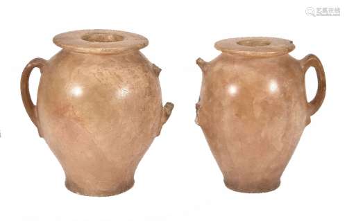 A pair of Egyptian carved alabaster vessels