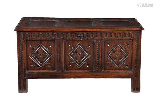 A carved oak triple panel coffer