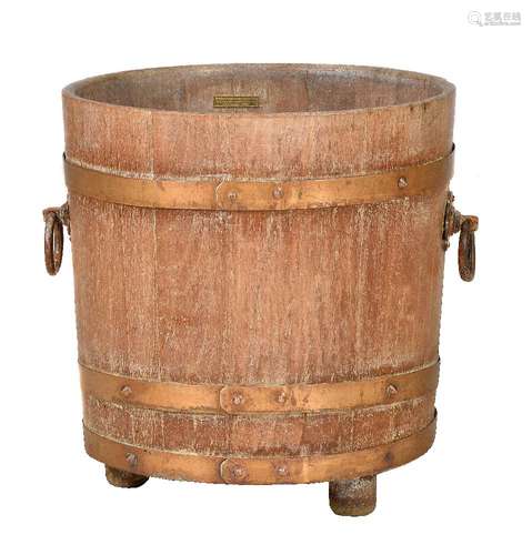 A teak and copper bound bucket or planter