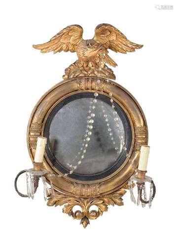 A giltwood convex wall mirror