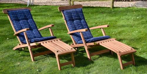 A pair of teak 'steamer' reclining chairs