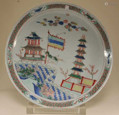 Porcelain plate. China. K'ang Hsi period (1662-1722). Famille Verte decoration of fortification with a banner. Lung Chih mark on the base. 15 