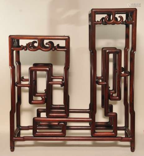 Plant stand. China. 19th century. Rosewood. Two tiered form with aprons carved with 