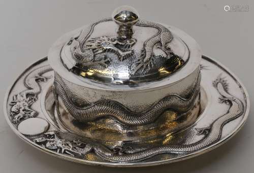 Chinese Export silver serving dish. Early 20th century. Repousse decoration of dragons on a punched ground. Signed ?? Chang. 192 grams.