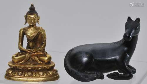 Lot of two bronzes. China. 19th century. To include: A gilt Buddha and a paperweight in the form of a reclining horse. Each about 2-3/4