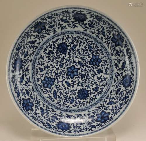 Porcelain bowl. China. 19th to 20th century. Underglaze blue Ming style heaped and piled decoration of stylized lotus scrolling. Ch'ien Lung mark. 13