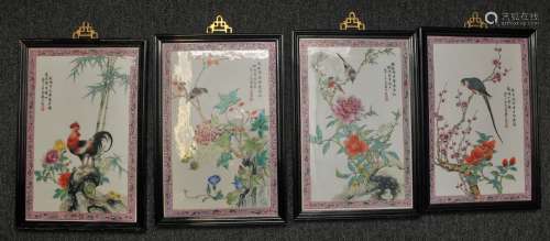 Set of four porcelain plaques. China. Circa 1950. Famille Rose decoration of birds and flowers. Mauve borders with floral scrolling. Framed. 15