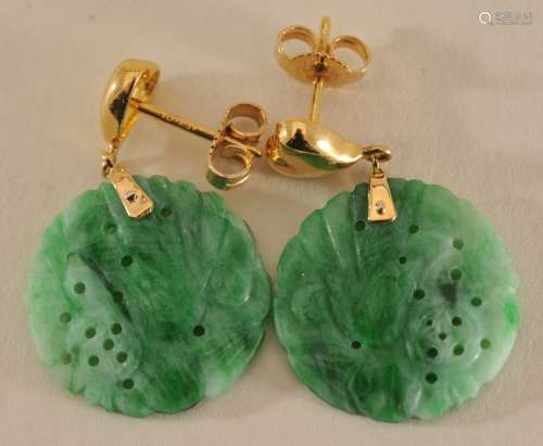 Pair of Jade earrings. Stone carved and pierced with flowers.