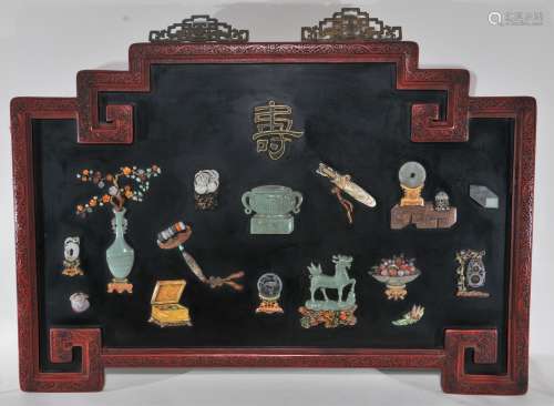 Wall plaque. China. 19th century. Archaic form. Frame of carved cinnebar lacquer. Panel of black lacquer inset with 