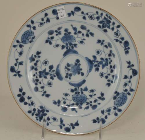Porcelain plate. China. 18th century. Underglaze blue floral decoration. 8-1/2
