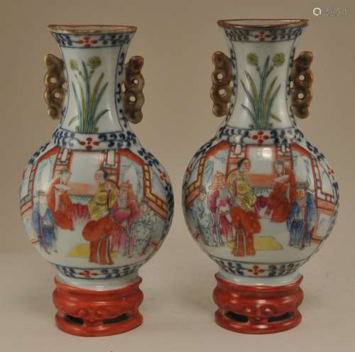 Pair of porcelain wall vases. China. 19th century. Famille Rose decoration of a filial piety scenes.  7-1/2