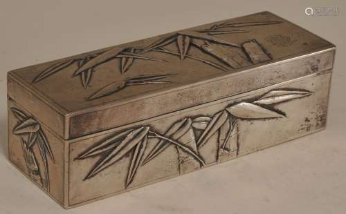 Silver box. China. Early 20th century. Rectangular form. Repousse decoration of bamboo. Signed on base- Zeewo. 5