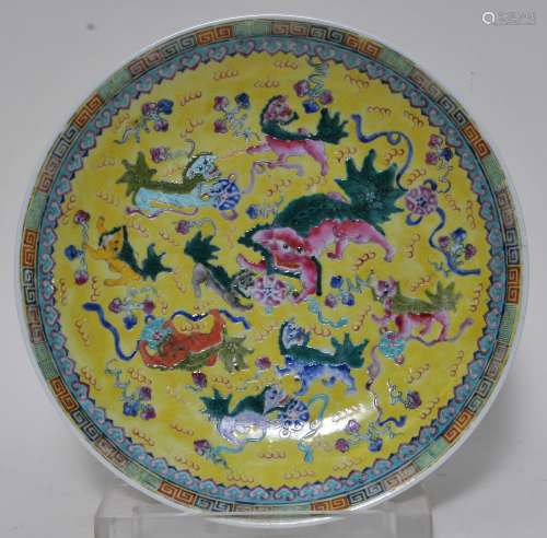 Porcelain plate. China. 20th century. Famille Jeune decoration of foo dogs and brocade balls. 13