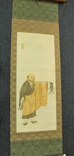 Hanging scroll. Japan. 19th century. Ink and colours on paper. Scene of a monk with a cat. Signed Kwanzan. 49
