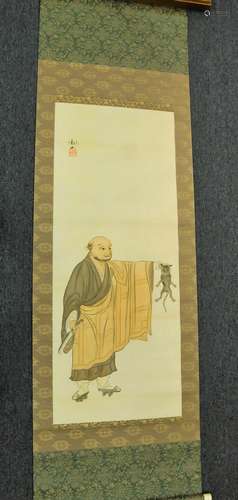 Hanging scroll. Japan. 19th century. Ink and colours on paper. Scene of a monk with a cat. Signed Kwanzan. 49