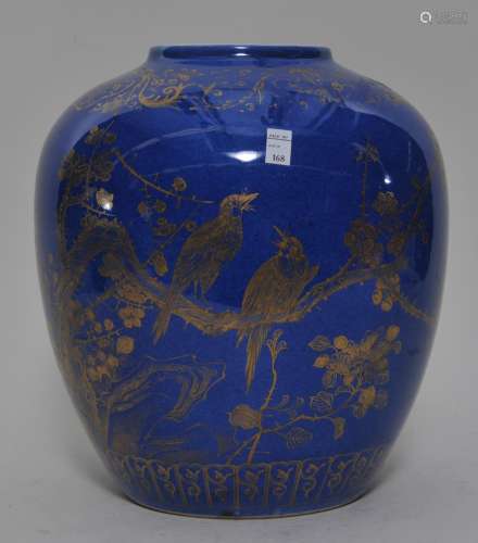 Porcelain vase. China. 19th century. Ovoid form. Powder blue glaze with gilt decoration of birds and flowers. Drilled for a lamp. 10-1/2